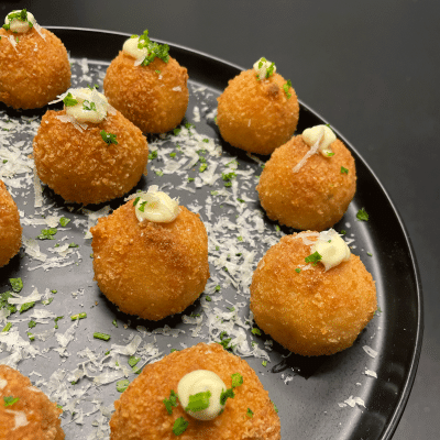 Roast pumpkin and parmesan arancini balls on a plate